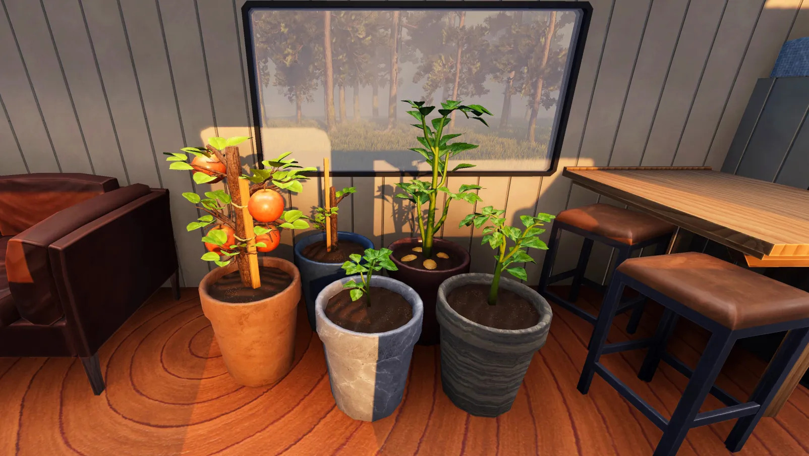Several potted plants arranged inside an RV with a view of the growing fruit.
